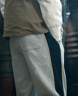 Gray sweatpants with side stripe tape and front pocket detail