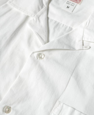 Ivory white short-sleeve shirt with buttoned cuff and chest pocket
