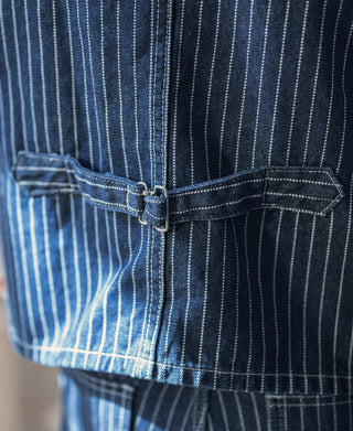 Indigo pinstripe work vest front with adjustable waist strap and patch pocket
