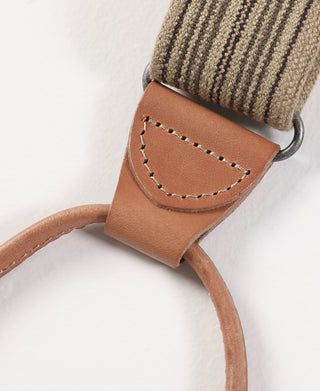 Brown leather strap loop with stitched panel on khaki striped suspenders
