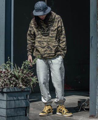 Light gray sweatpants with drawstring waist and ribbed ankle cuffs