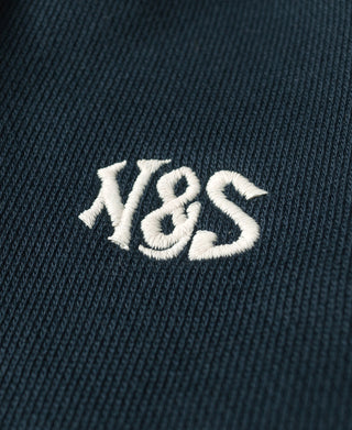 Navy sweatpants with white “Y&S” embroidered logo text