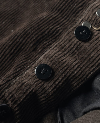 Brown corduroy work pants with black button closure detail