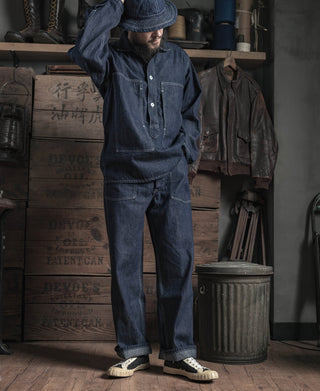 Indigo denim fatigue dungaree pants with front patch pockets and button placket