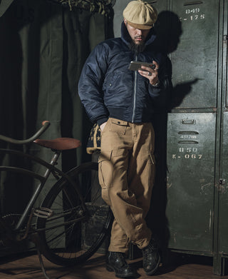 Navy B-15C flight jacket on model with shearling-style collar and front zipper
