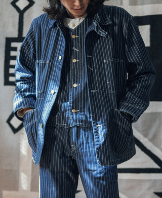 Indigo pinstripe work vest with pointed collar, five buttons, and flap chest pockets