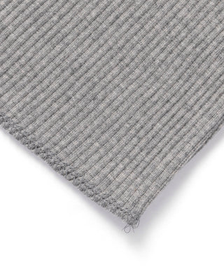 Gray cotton tank top hem corner with stitched edge