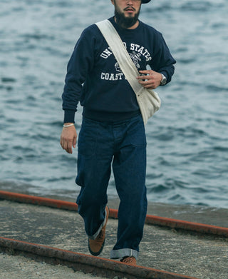 Navy reverse weave sweatshirt with Coast Guard chest graphic and ribbed crew cuffs
