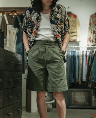 Olive bermuda shorts with large front pockets and belt loops